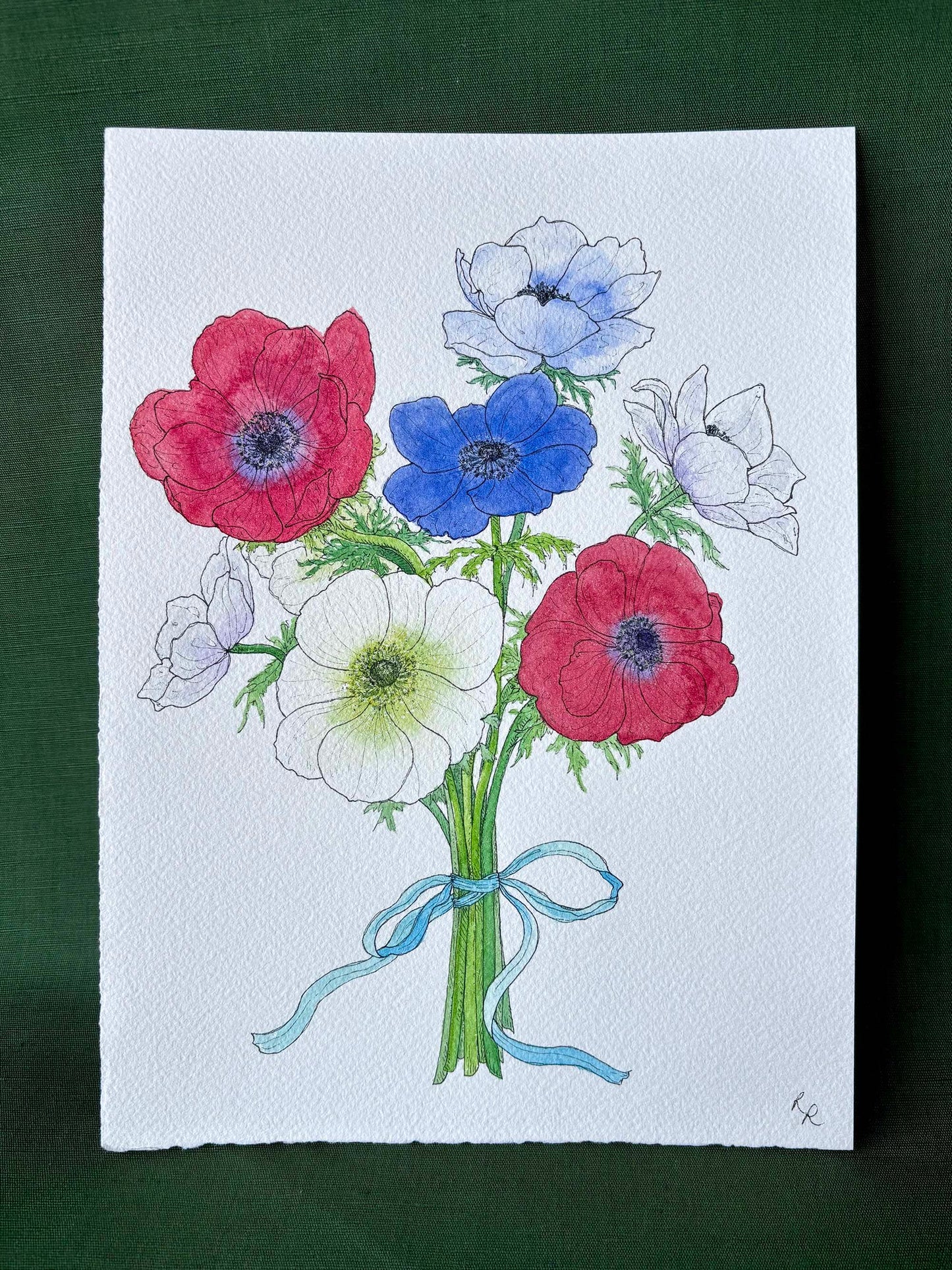 A watercolor painting of an anemone flower bouquet on textured white paper, featuring red, blue, and white anemone flowers tied with a light blue ribbon